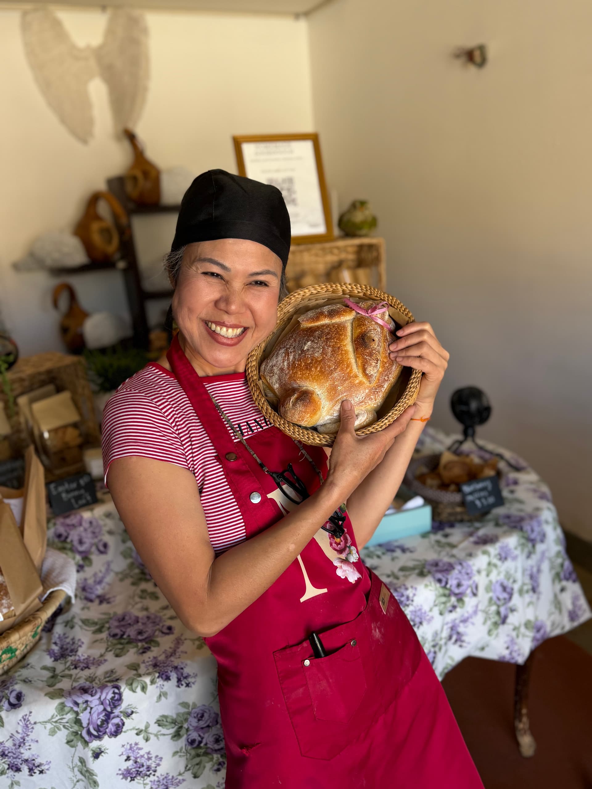 Anina holding a loaf of sourdough